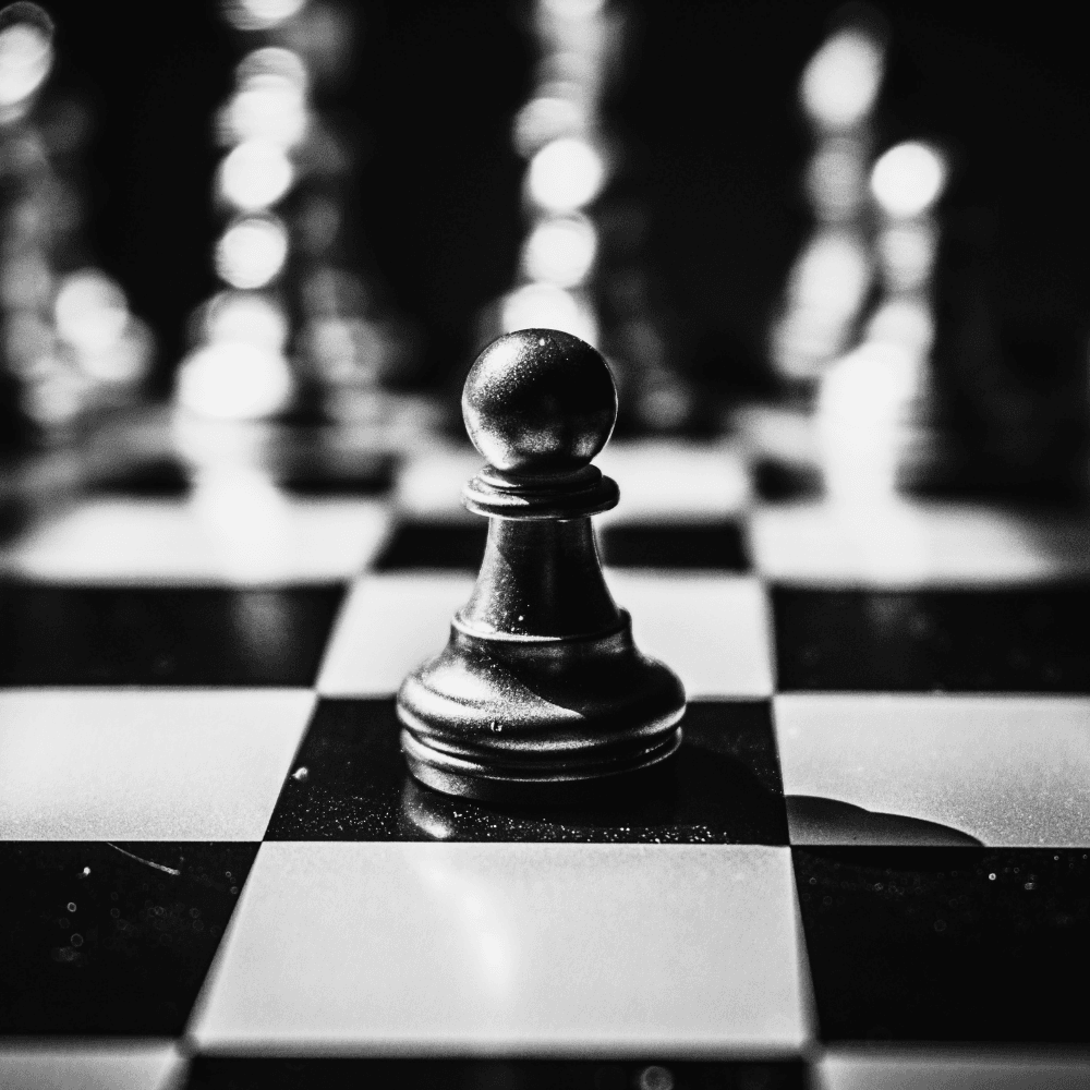 Black and white chess pawn piece on a dark background